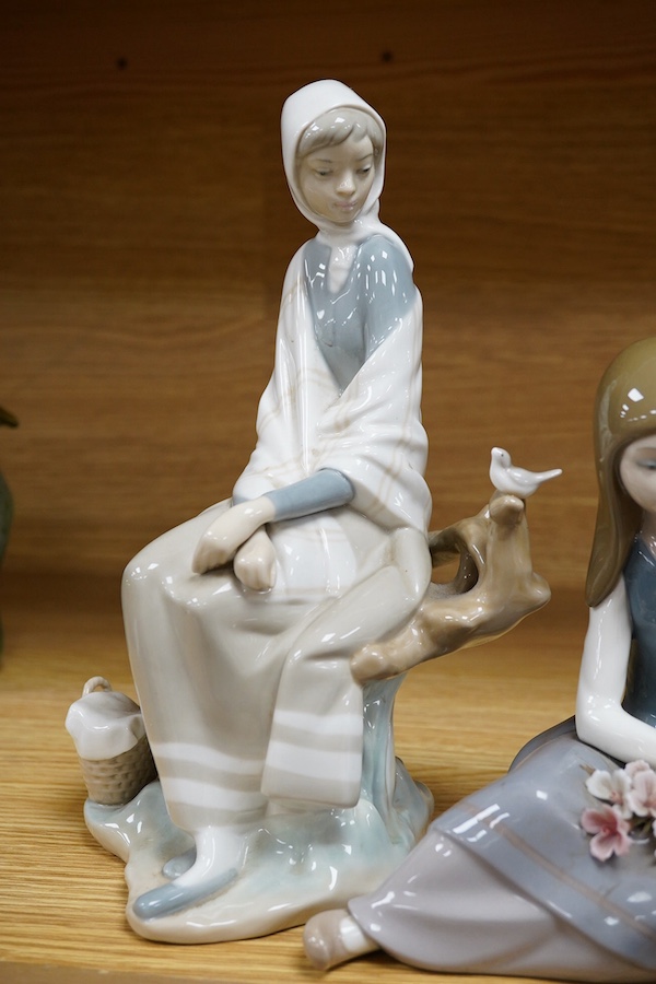 Three various Lladro figures, tallest 24cm. Condition - fair to good